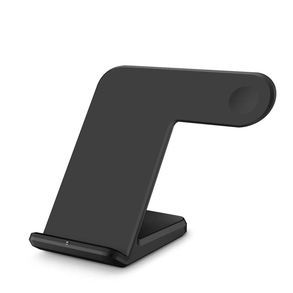 Black wireless phone charger on a desk next to a mobile phone, with a white Type-C cable.