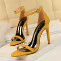 Women's open toe high heel sandal with an ankle strap buckle, in artificial PU material.