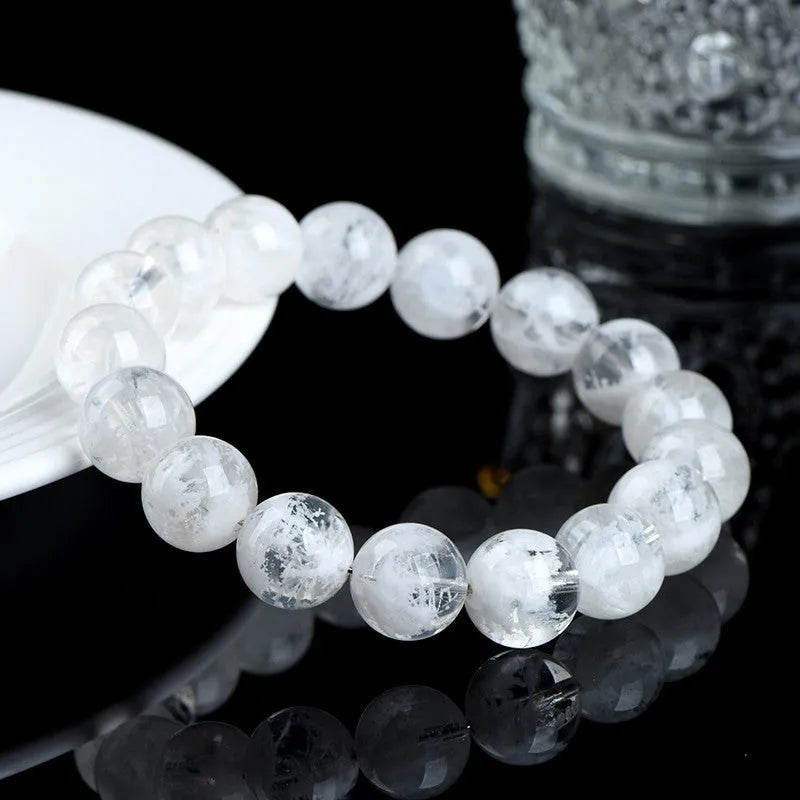 Women's crystal bracelet with natural blizzard snowflake round beads and traditional charm elements