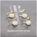 Silver plated gradient colour amethyst water drop tassel ear studs with flower core pattern on white background
