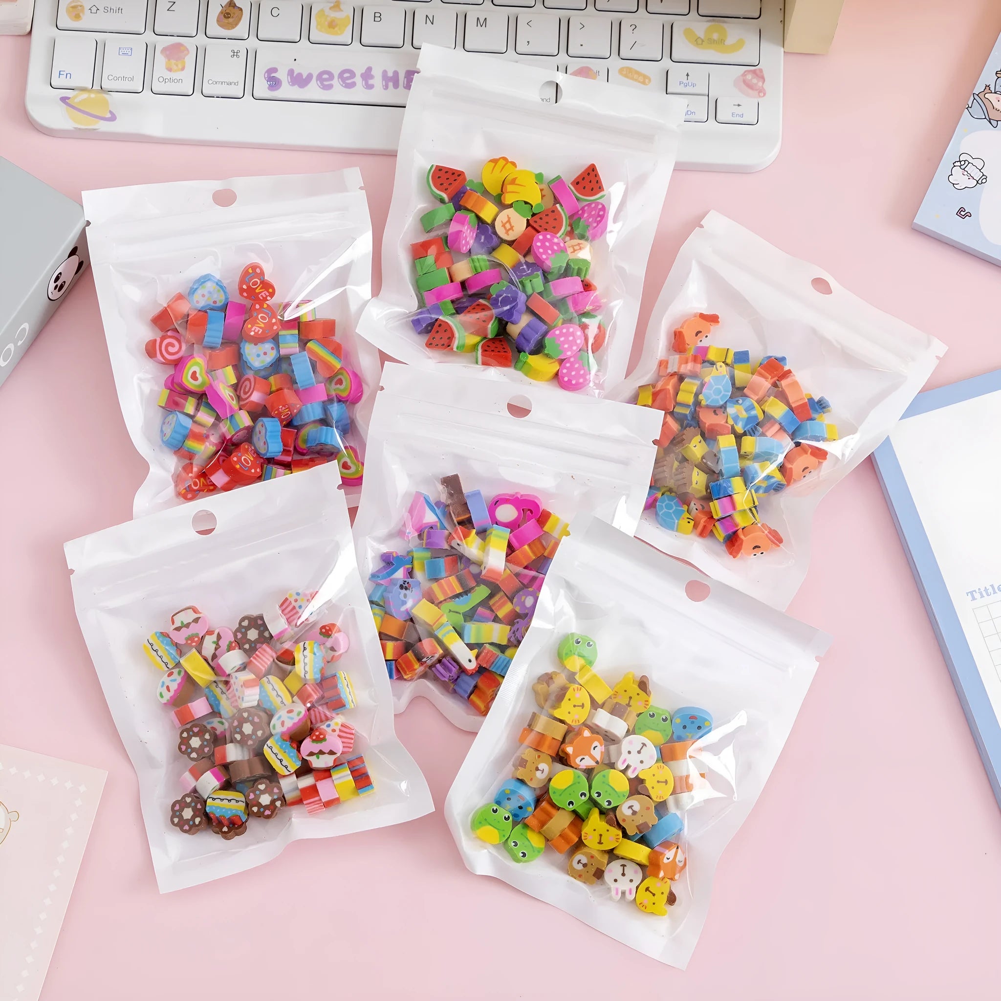 Pearlescent bag with 50 colourful TPR cartoon mini erasers, 1-1.5cm, showing fruit, animal, and themed shapes.