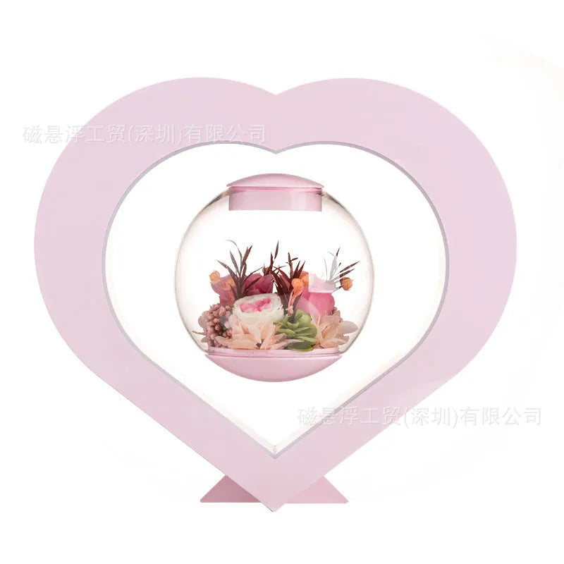 Pink preserved real rose ornament in a decorative case with optional base and Bluetooth speaker.