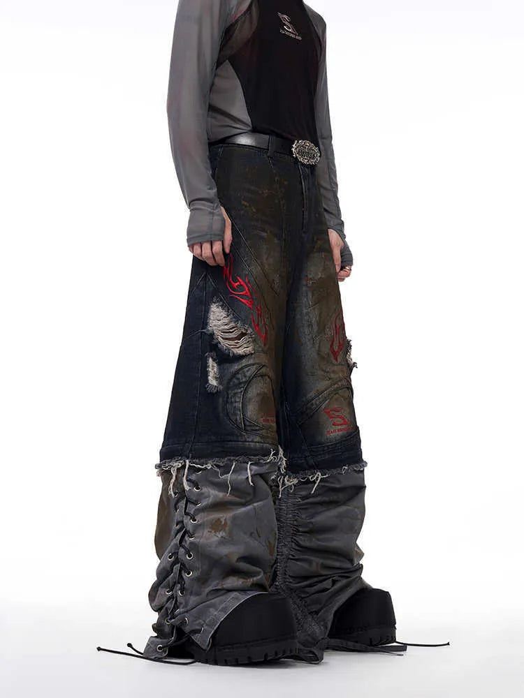 Men's retro style denim jeans with detachable trouser legs in a wide leg, loose fit.