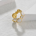 A geometric stainless steel ring with an adjustable opening and an electroplated finish.