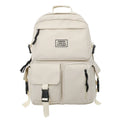 Black nylon student backpack showing front three-dimensional pocket and internal laptop compartment.
