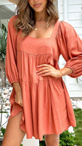 Children's orange backless dress with square collar neckline and puff sleeves in A-line silhouette