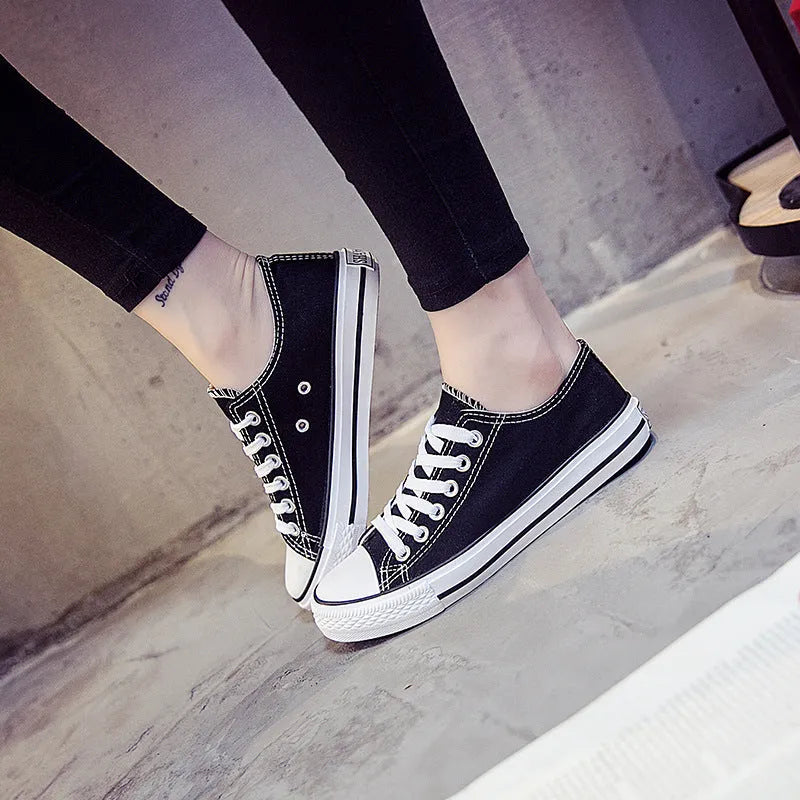 Women's casual canvas shoes in solid colours showing black, white black, white red, and all black options