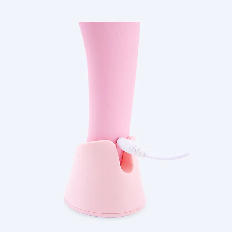 Pink electric silicone face cleansing brush with vibration and heating functions, USB rechargeable