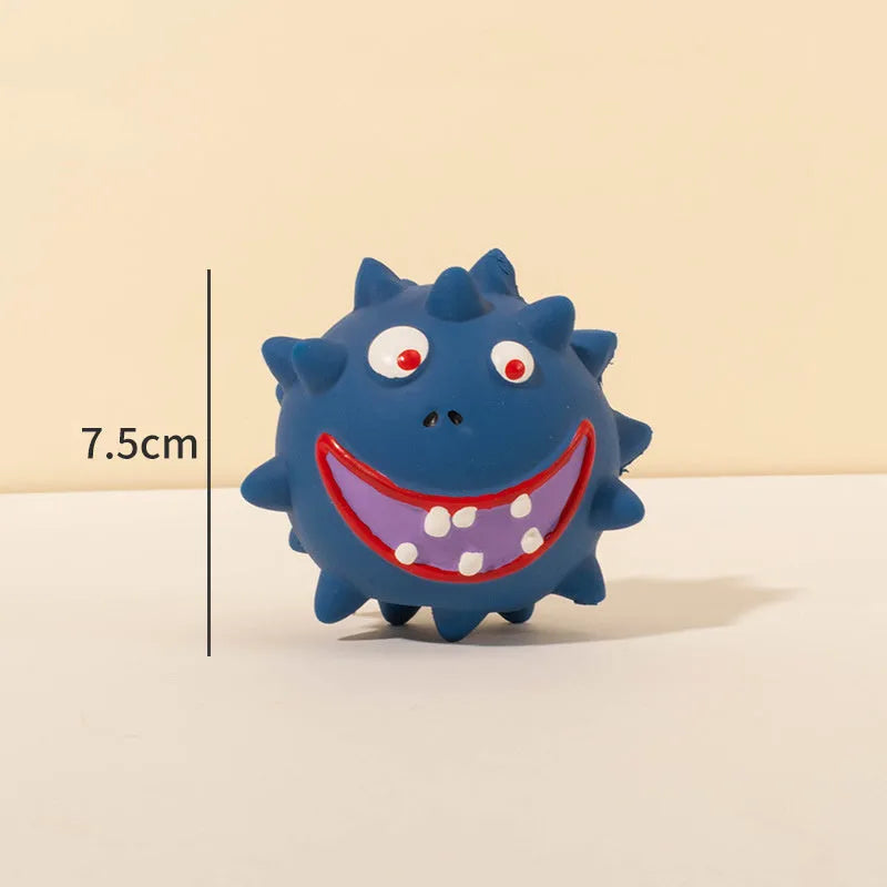 Four colourful natural latex squeaky dog toy balls with cute faces on a blue background.