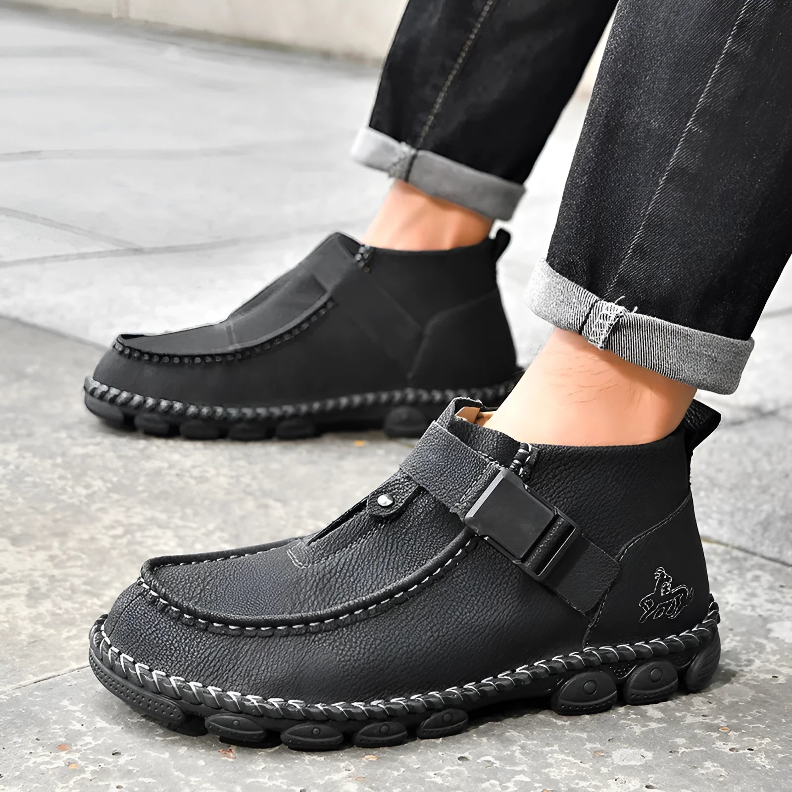 Men's black handmade stitching casual flat bottom slip on shoes made from synthetic leather.
