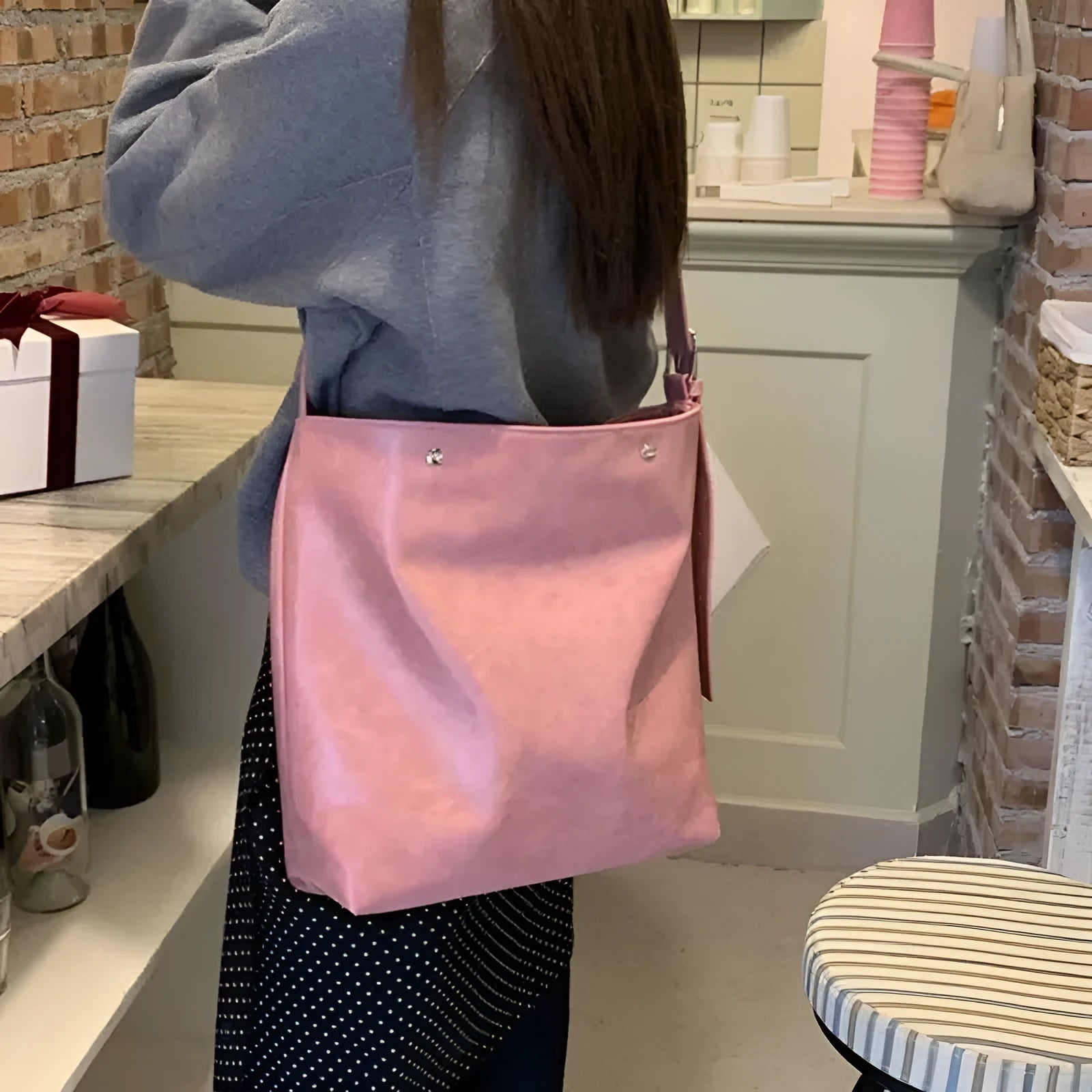 Pink or brown corduroy one-shoulder commuter bag showing dimensions