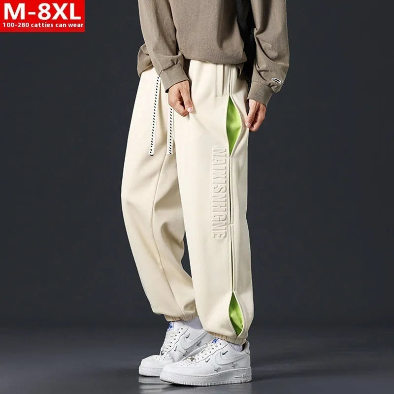 Men's black banded ankle cotton trousers with stitching detail and loose fit design
