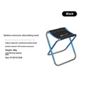 Black ethnic style folding camp stool with 7075 aluminium alloy frame in folded position.