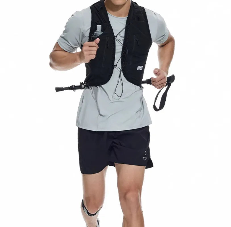 Black running shorts with laser-punched stitching and four-sided stretch fabric laid flat.