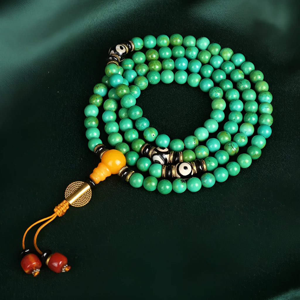 Natural turquoise bracelet with 108 round 8mm beads on a white background