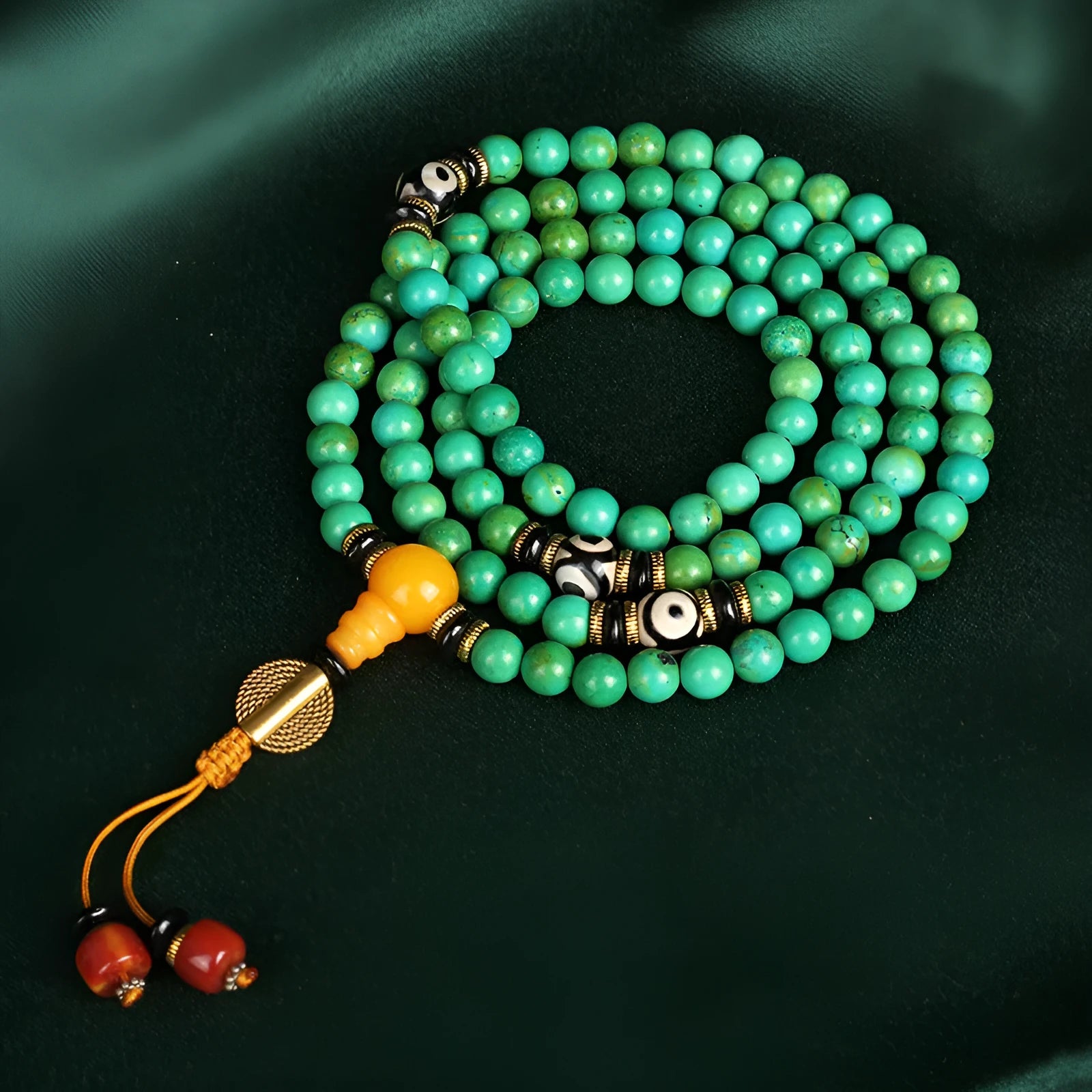 Natural turquoise bracelet with 108 round 8mm beads on a white background