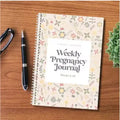 A5 Pregnancy Weekly Diary Notebook open showing weekly layout pages