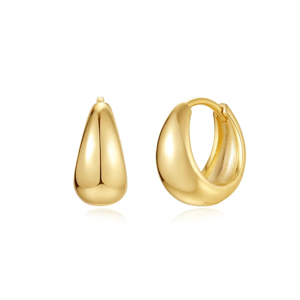 Brass geometric earclip earrings with gold electroplated finish and round design elements