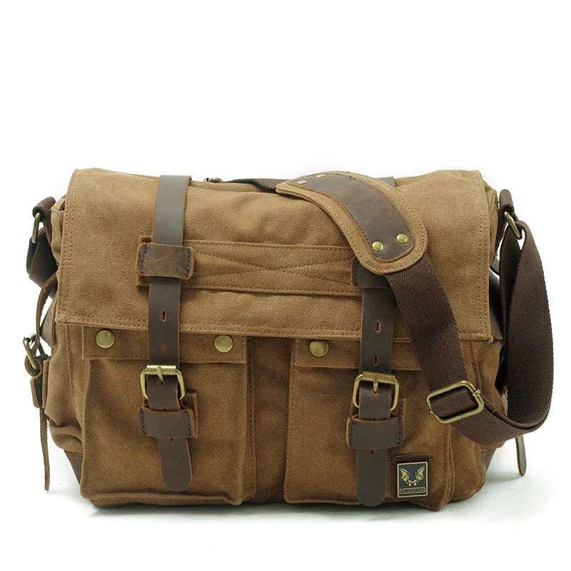 Men's army green canvas crossbody flap bag with leather trim shown open, revealing internal phone and document pockets.