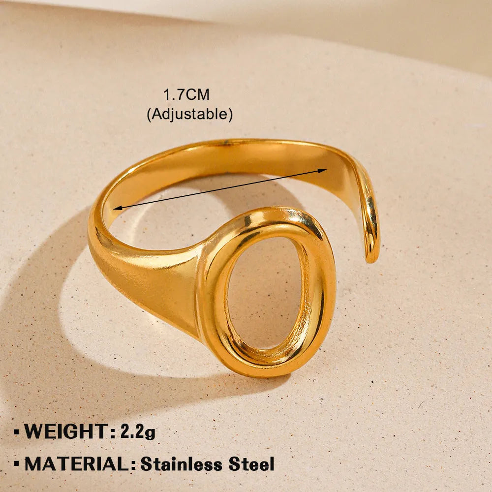 Oval ins style adjustable stainless steel ring in gold and steel colours on white background