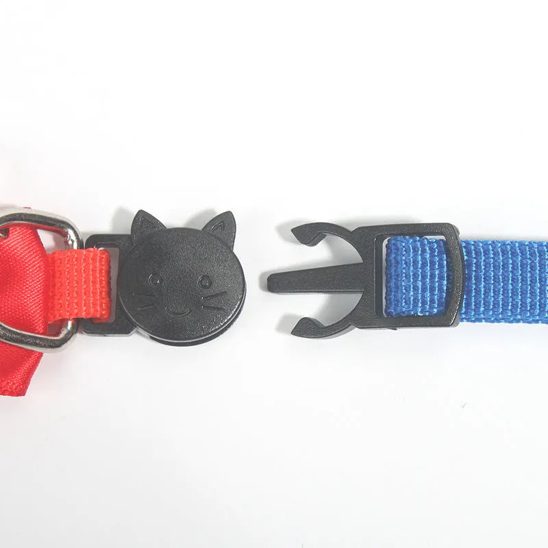 Adjustable nylon cat bow collar with a bell in a striped pattern, shown in a bright colour.
