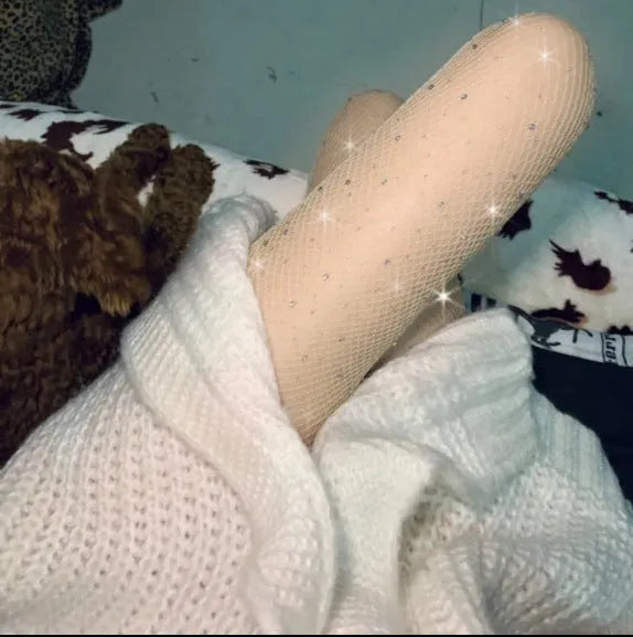 Women's nylon fishnet stockings in diamond mesh pattern, shown in skin colour.