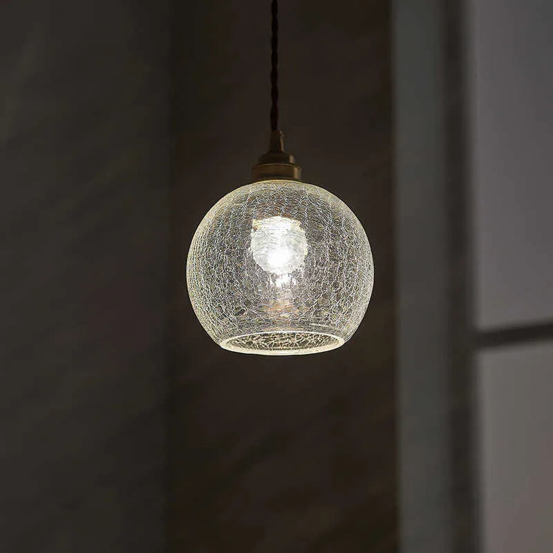Retro-style brass and glass ball chandelier ceiling light with copper body and spherical shades.