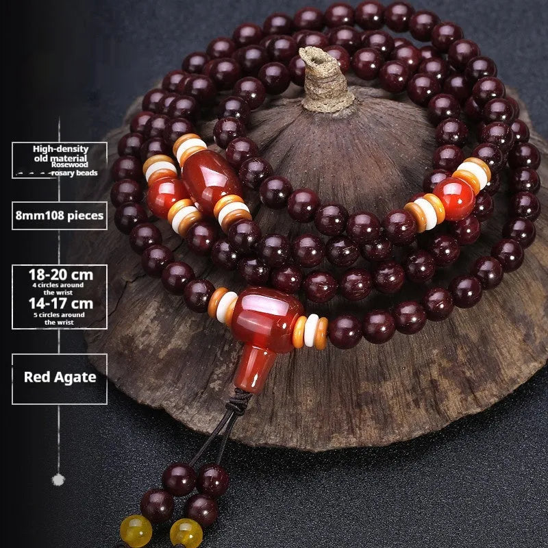 Men's rosewood 108-bead mala bracelet with detailed turquoise and silver beads on wrist.