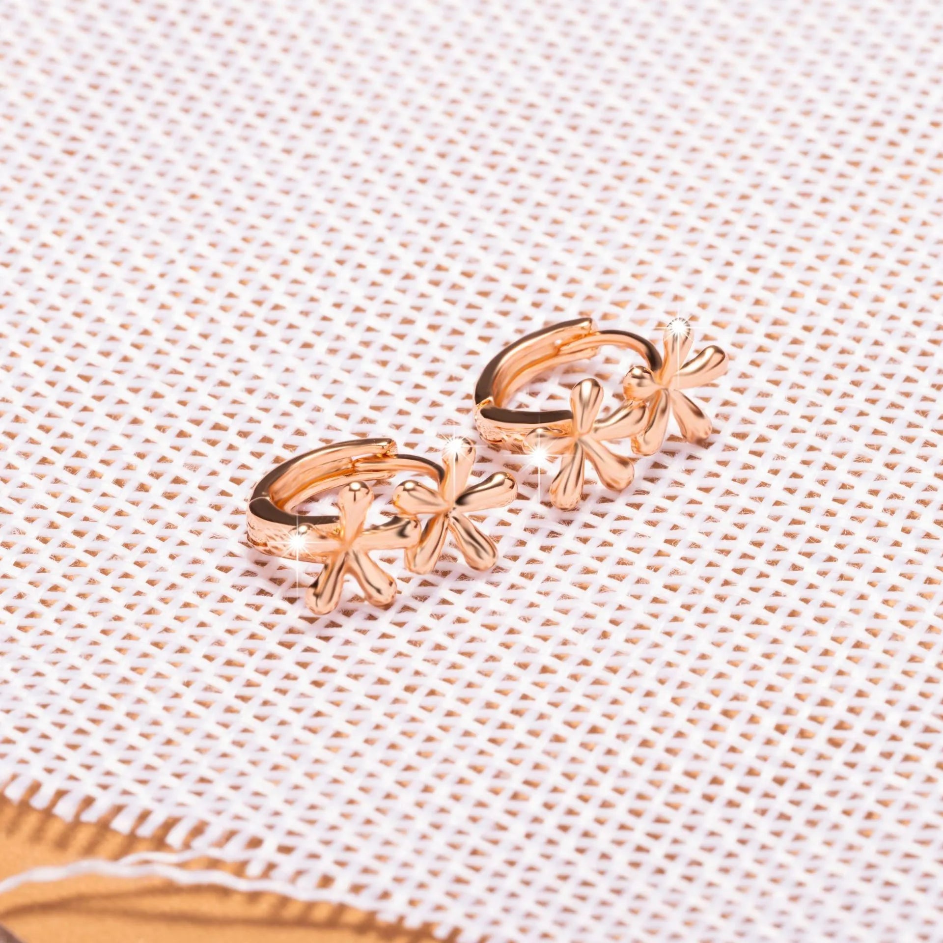 Rose gold electroplated waterdrop flower earrings with circular design and butterfly backs