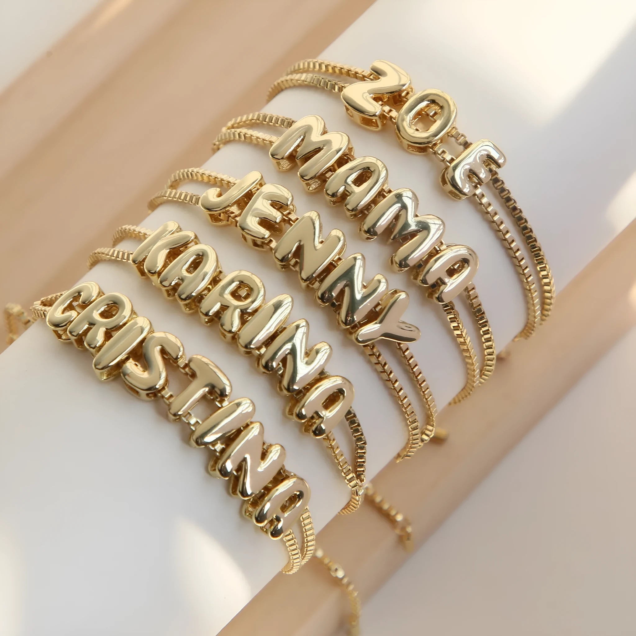 18k brass smooth surface bubble letter bracelet with pendant in gold colour on copper alloy