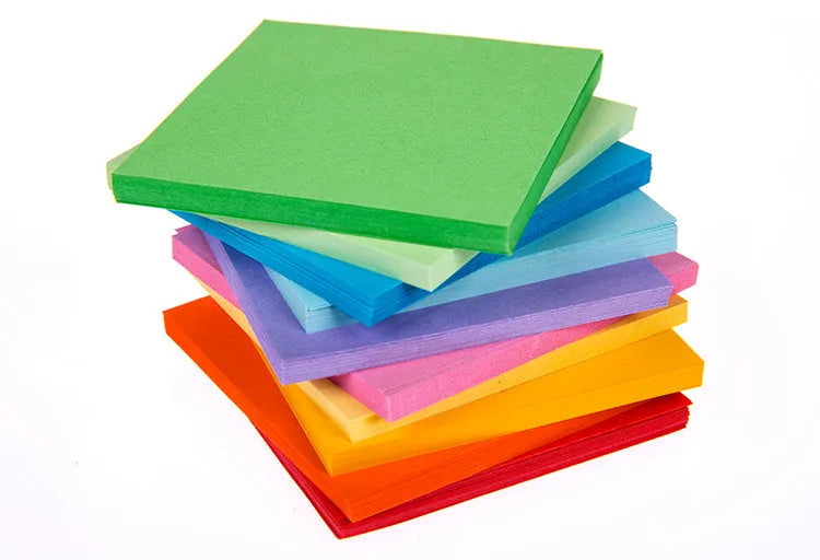 Assorted coloured mini paper scrolls for drift bottle messages with metal eyelets, shown in different sizes.