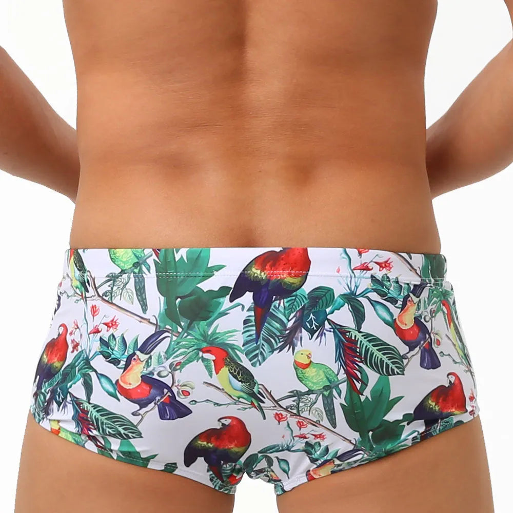 Men's floral and bird print swimming trunks in nylon fabric with elasticated waistband