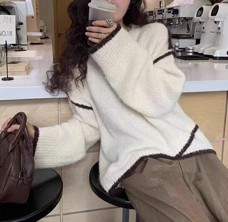 Women's idle style gray cotton loose pullover sweater on a plain background