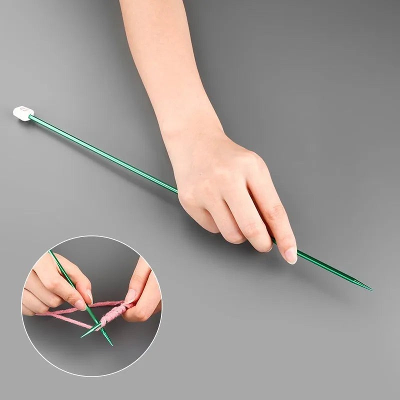 Set of long-handle metal crochet hooks with protective end caps arranged by size