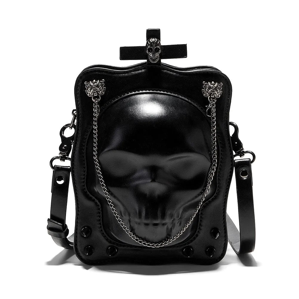Black mini skull shoulder bag with 3D embossed design, chain strap, and vertical square shape for Gothic fashion.