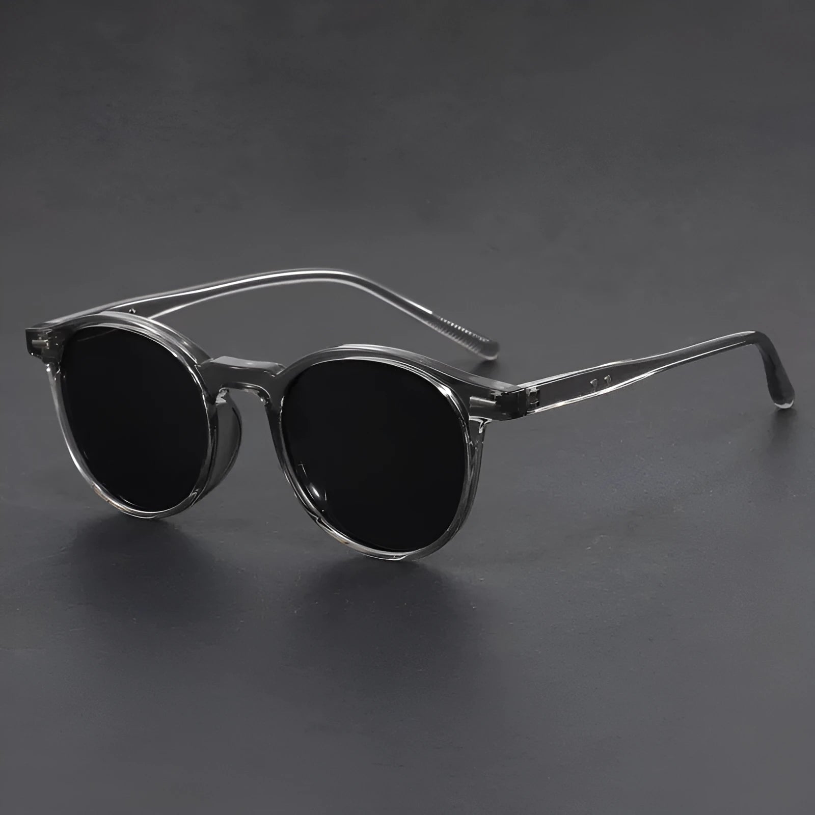 Retro oval frame sunglasses with polarised grey lenses in various frame colours on a light background