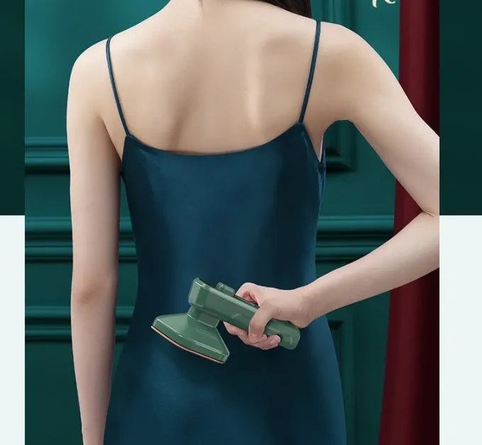 Dark green portable hanging steam iron with ceramic panel, compact design for travel garment care