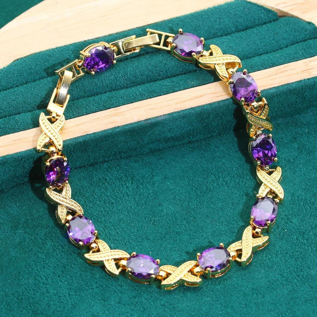 18k gold plated zircon jewellery set showing necklace, earrings, ring and bracelet with coloured cubic zirconia stones