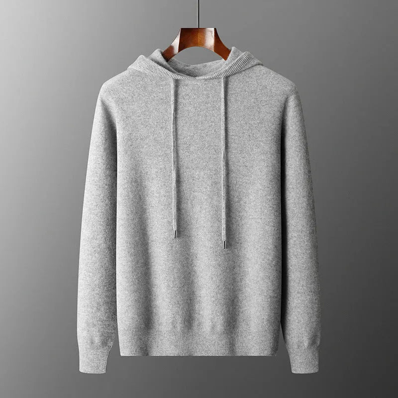 Men's dark grey cashmere hooded sweatshirt and matching long pants laid flat as a complete set.
