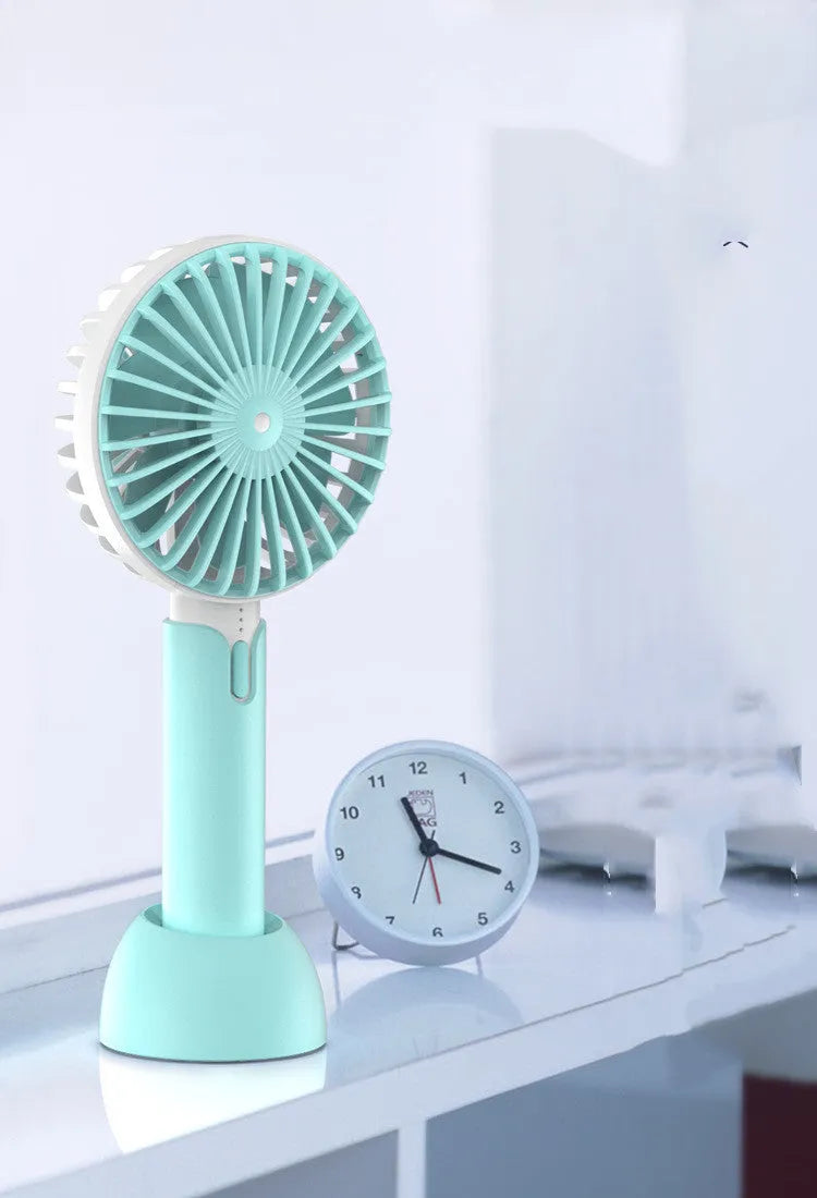 Blue mini USB electric fan with three-speed control on desk