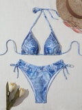 Women's denim blue printed strappy bikini set showing front view of two-piece swimwear