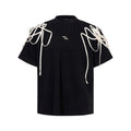 Black loose fit T-shirt with padded shoulders and short sleeves on hanger