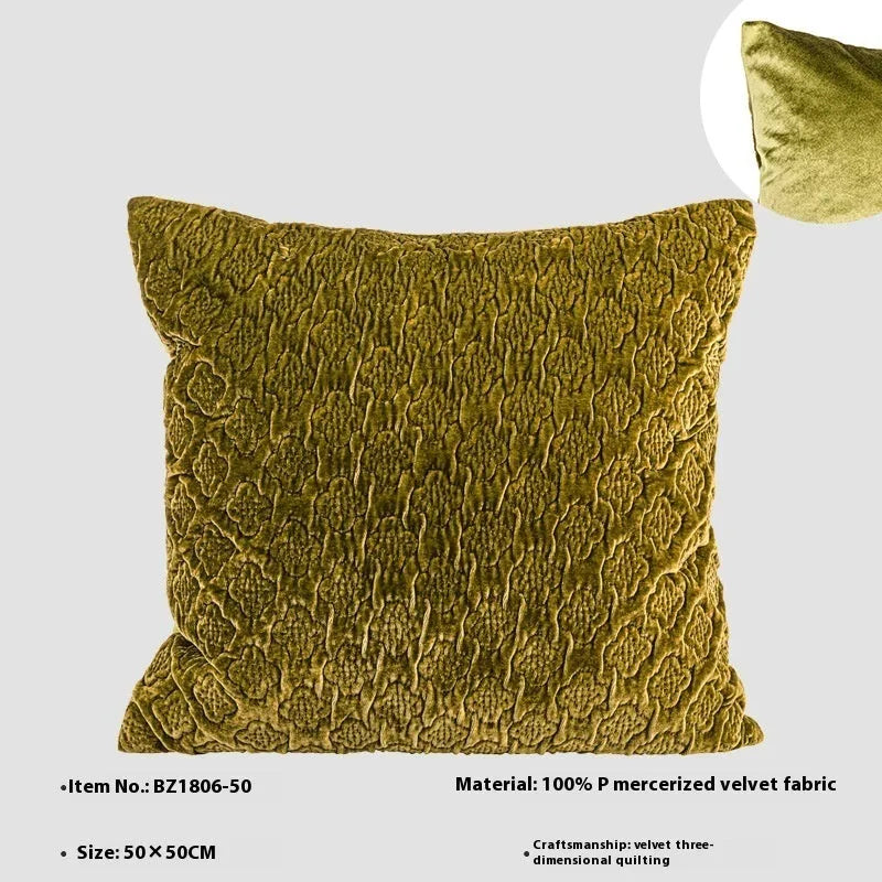 Brown gold antique-style quilted square cushion pillow and matching lumbar pillow on a sofa.