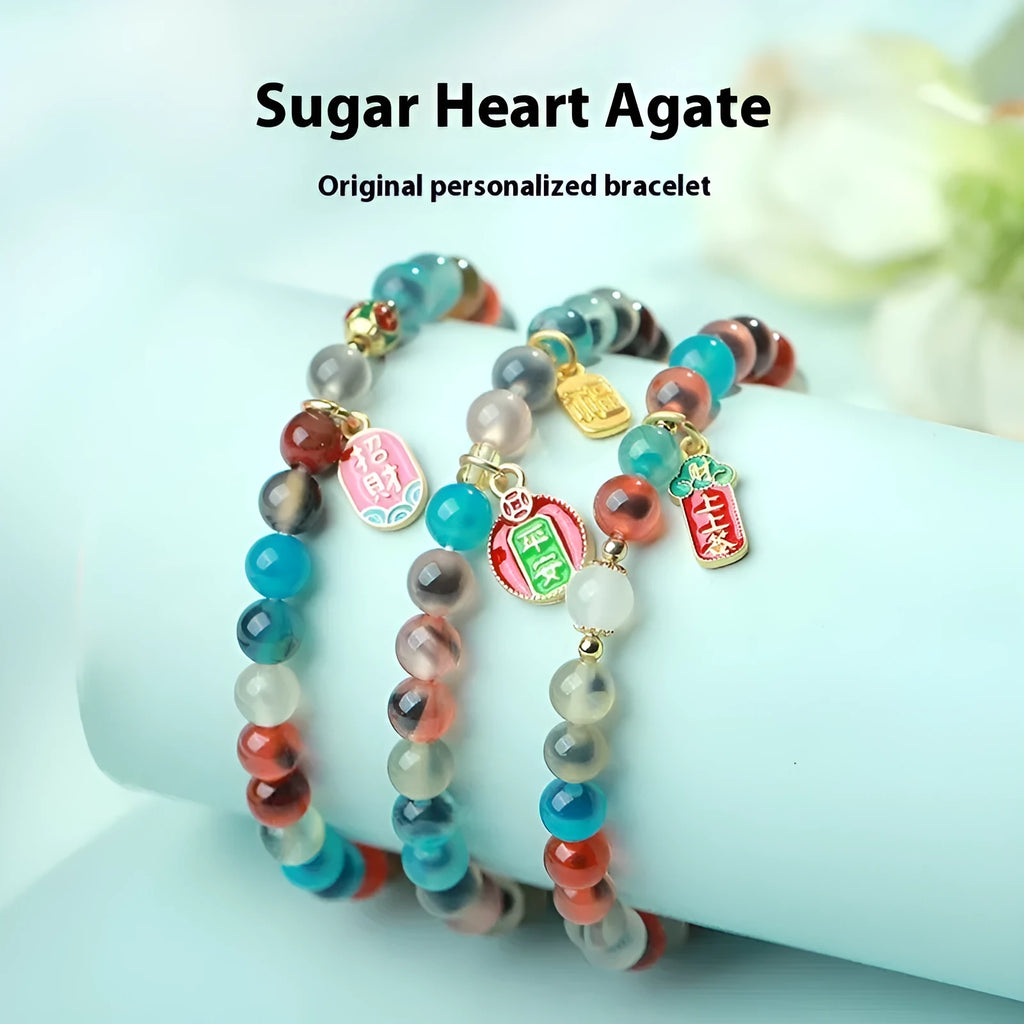 Women's geometric bracelet with colourful sugar heart agate beads and a detailed copper coin snake chain.