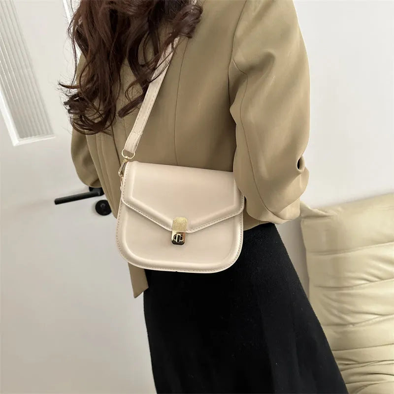 Soft PU leather messenger bag in clam shell design, shown in a horizontal square shape with a shoulder strap.