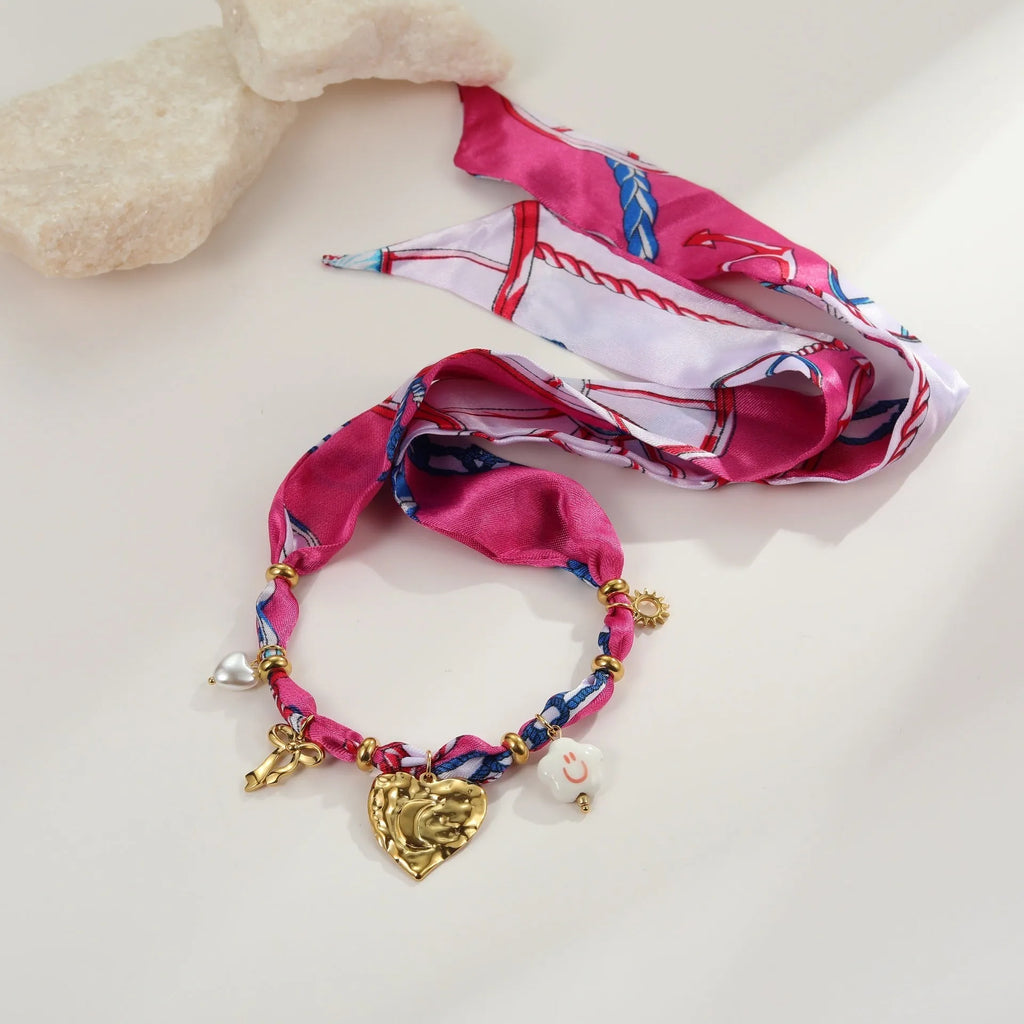 Stainless steel necklace and bracelet set with geometric pendant on adjustable chain