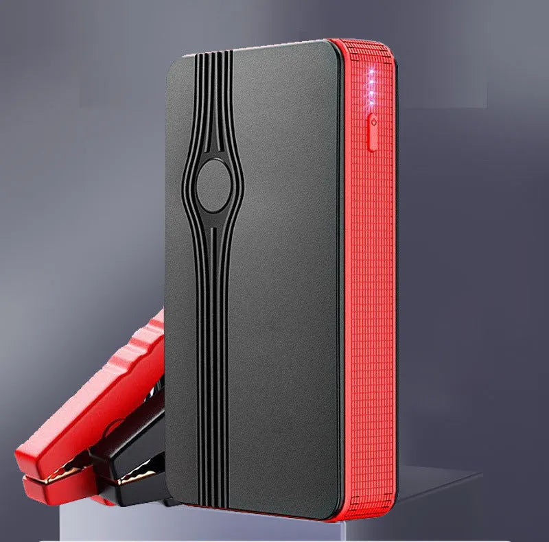 Red K4-E automobile emergency starting power supply unit with data cable, showing compact dimensions
