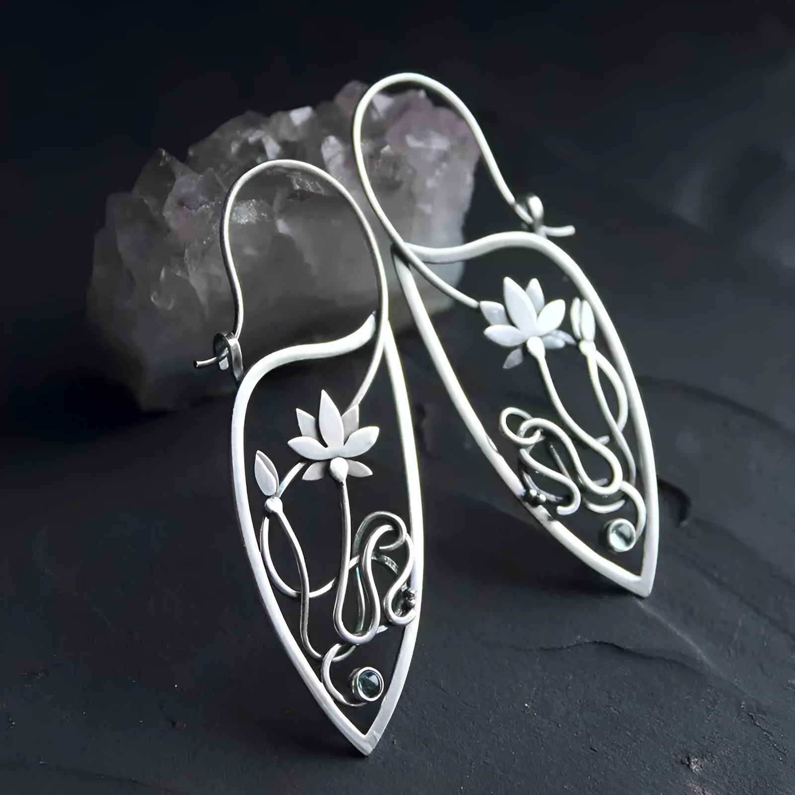 Silver rhinestone earrings with geometric lotus vine design on alloy base