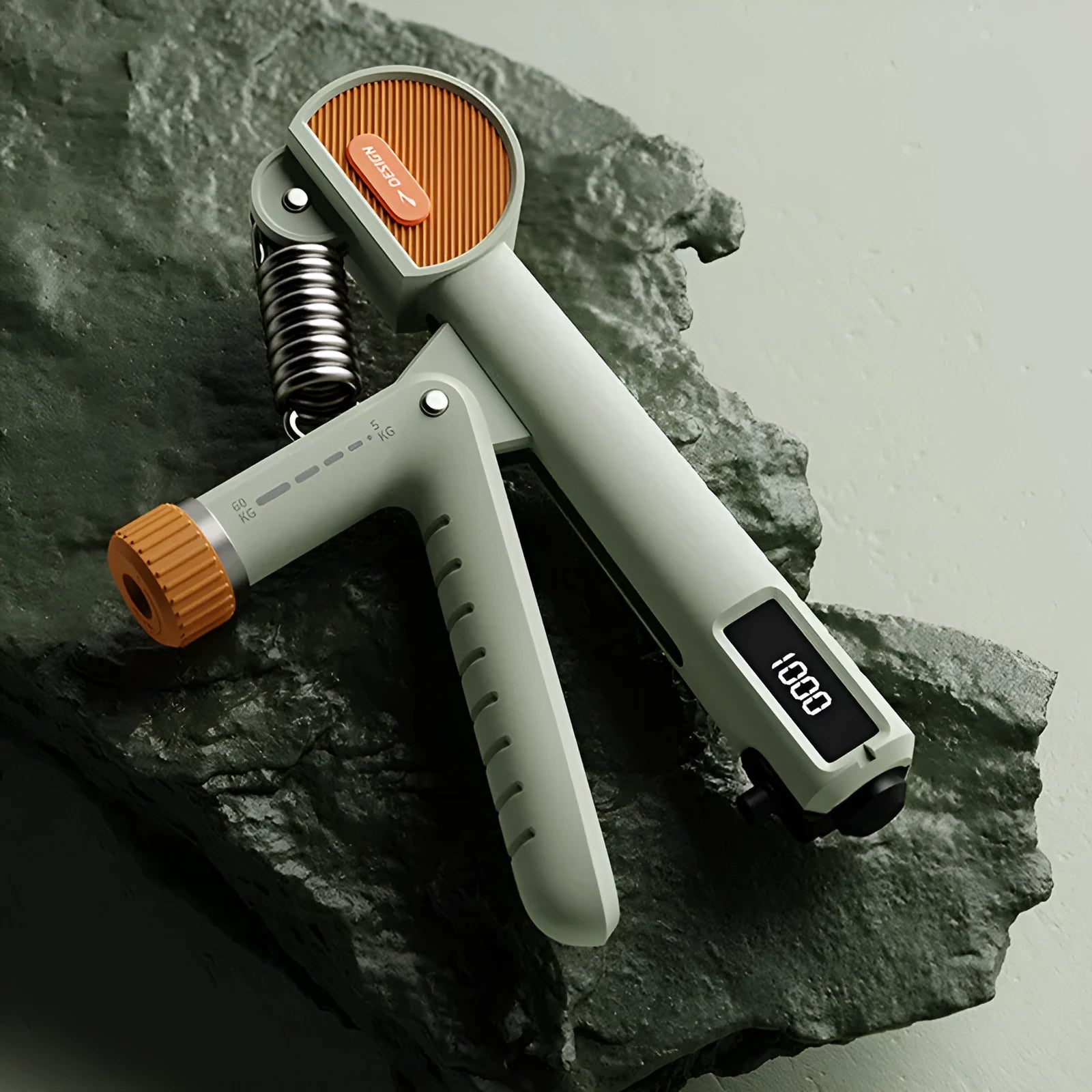 Adjustable spring hand gripper for strength training in ABS plastic, shown in multiple colour options.