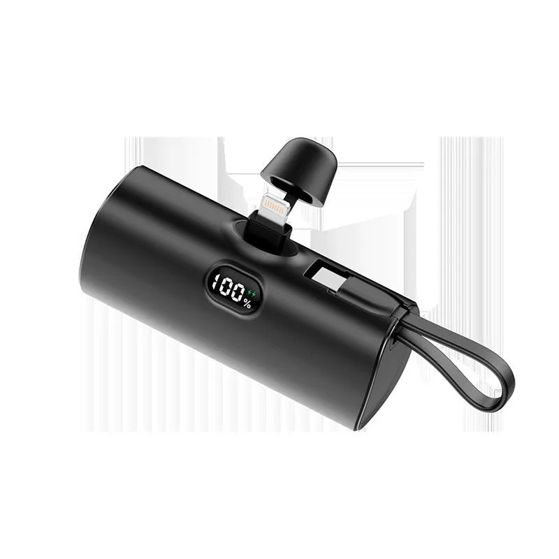 Compact wireless power bank with digital display showing battery percentage and built-in folding plug